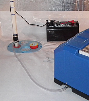 Closeup of a crawl space sump pump installed in Queensbury