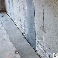 an ugly basement weeping tile drainage system that's clogged and not working in Saratoga Springs.