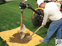 Auguring a hole in the earth for a foundation repair in Delmar
