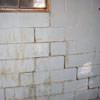 A cracked foundation wall near a window in a Ballston Spa home