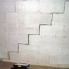 A diagonal stair step crack along the foundation wall of a Watervliet home