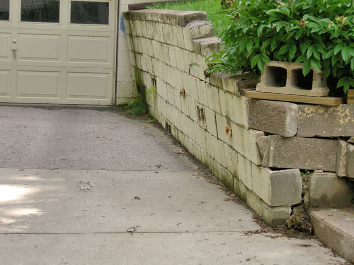a failing retaining wall around a driveway in Schenectady