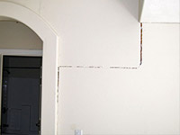 Drywall cracking due to foundation settlement in Rensselaer