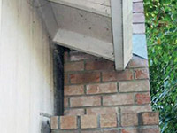 A chimney leaning away from the home on a Slingerlands foundation