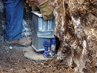 Securing a foundation footing bracket for a foundation repair system in Gloversville.
