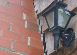 A tilting chimney in Ballston Lake showing serious foundation damage.