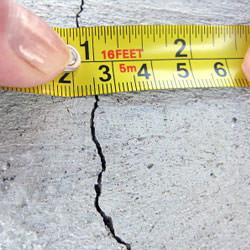 A crack in a poured concrete wall that's showing a normal crack during curing in Hudson Falls
