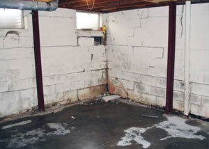 A failed, rusty i-beam foundation wall system installed in Johnstown.