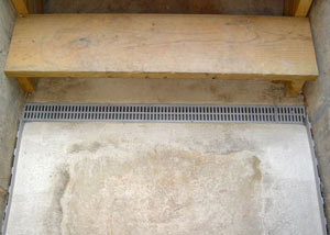 Our grated drain system installed on a leaking basement staircase in Johnstown.