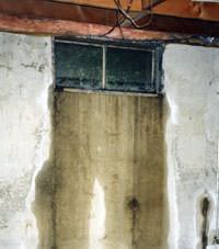 Flooding through basement windows in a Hudson Falls home.