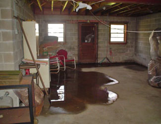 a flooded basement floor in a Hudson Falls home