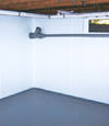 Troy, NY wet basement wall covering that tucks into a perimeter drainage system