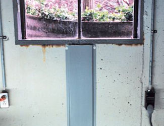 Repaired waterproofed basement window leak in Guilderland