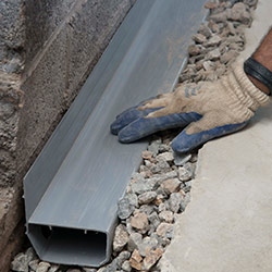 installing a drain tile system in a Slingerlands home